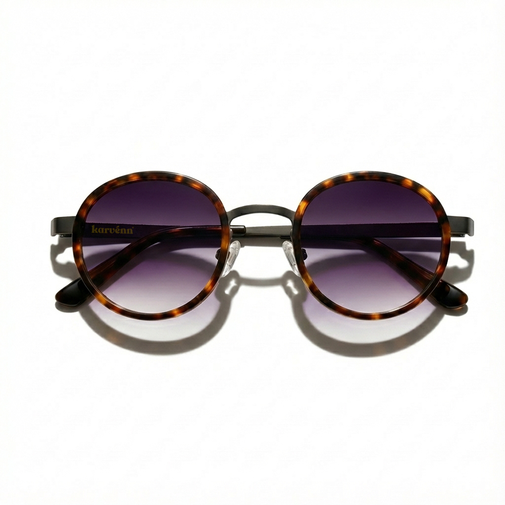 Round sunglasses with tortoiseshell frame and purple gradient lenses on a white background