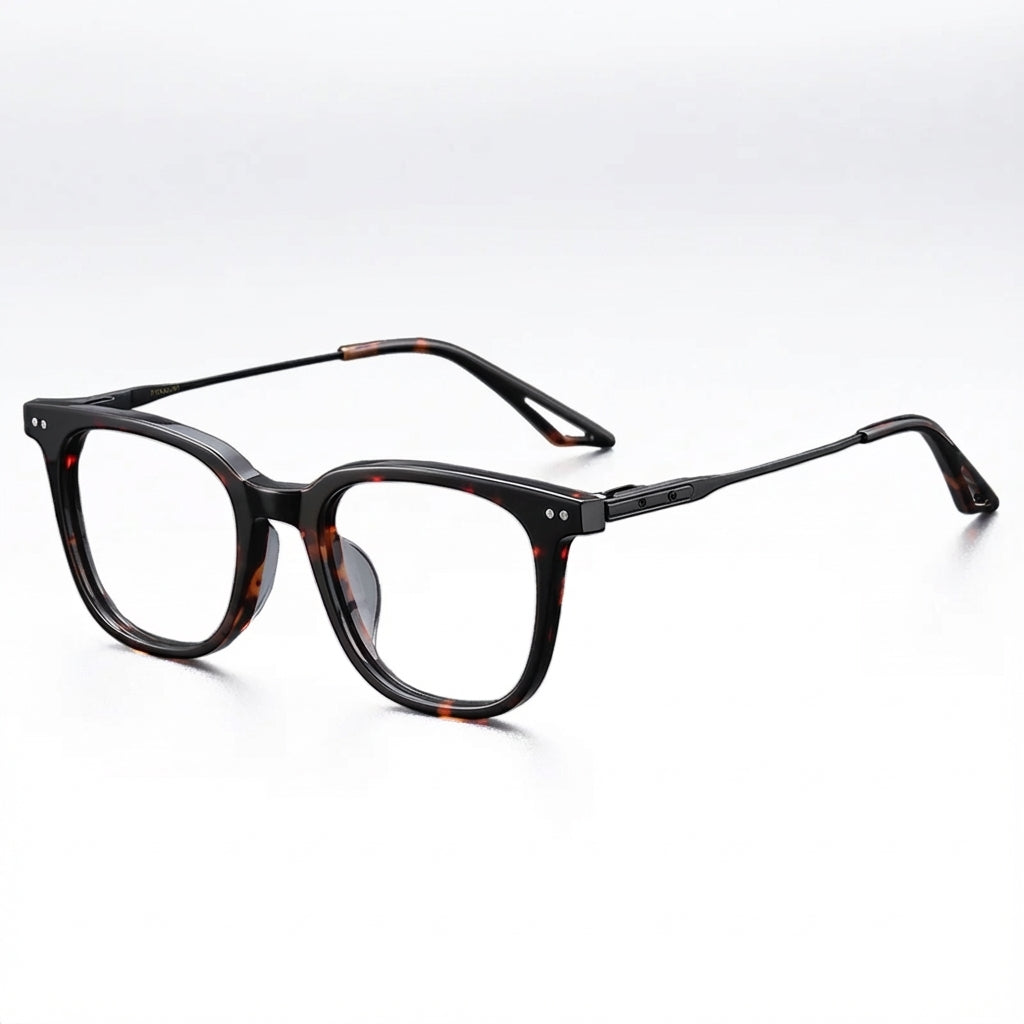 Black tortoiseshell eyeglasses on a white background